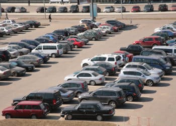 cars lined up in parking lot aerial view