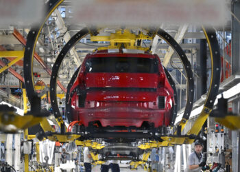 New Fiat Grande Panda EV model automobiles in cradles on the production line at the Stellantis NV manufacturing plant in Kragujevac, Serbia, on Monday, July 22, 2024. Fully electric and hybrid variants of the Grande Panda are planned for Serbian production. Photographer: Oliver Bunic/Bloomberg